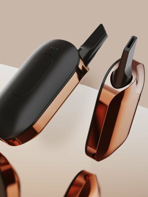 The Compass [Copper] + features a sleek metallic copper and matte black finish, showcased against a beige background to emphasize its smooth lines and minimalist design.
