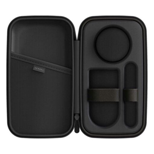The Drift Case [Gunmetal] is open, showing custom foam compartments, elastic bands for organization, a mesh pocket on the left, and a fabric label with VESSEL in sleek gunmetal.