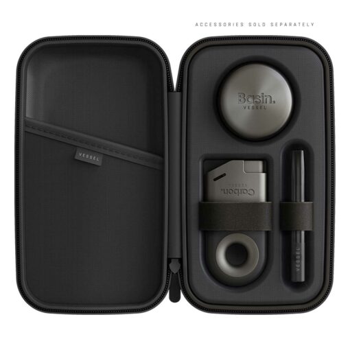 A Drift Case [Gunmetal] opens to reveal organized compartments holding a round container, rectangular device, ring accessory, and pen-shaped item. ACCESSORIES SOLD SEPARATELY appears above.