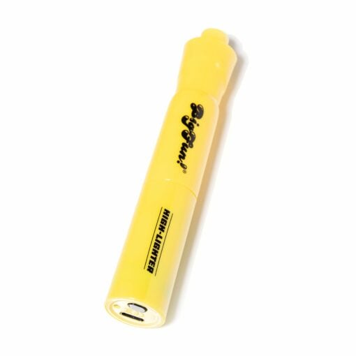 A yellow highlighter pen labeled Pigment and High-Lighter rests on a white background, viewed at an angle—its sleek design reminiscent of the BIGFUN! High-Lighter Vaporizer.