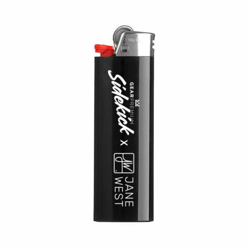The Limited Edition JW Sidekick by GEAR Premium® is a black disposable lighter with a silver top, red spark wheel, and white "JW Sidekick x Jane West" text printed vertically—an exclusive accessory for true fans.