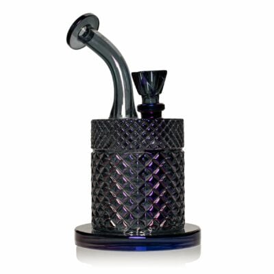 The Twenties Collection Water Pipe | Midnight is a dark, intricately patterned glass piece with a cylindrical base, angled mouthpiece, and top bowl, showcased against a white background.