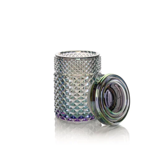 The Twenties Collection Jar | Mermaid, with a textured, iridescent finish, stands open and empty on a white surface. Its matching multicolored lid is placed beside it.