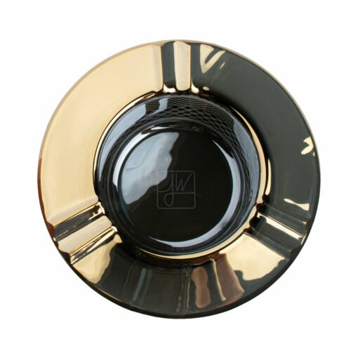 The Twenties Collection Ashtray | Gold features a round, glossy design with a metallic gold and black finish, three cigarette grooves, and a reflective surface.