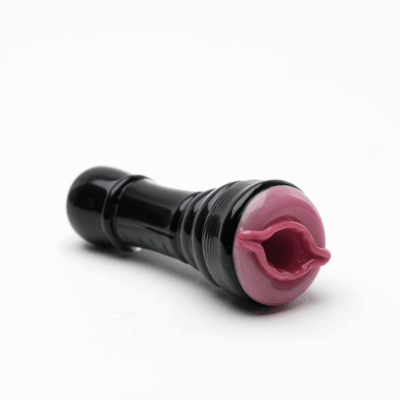 The Empire Glassworks Kittylight Chillum is a black and pink handheld glass device with a cylindrical shape and an open end, photographed on a white background, designed for unique style.