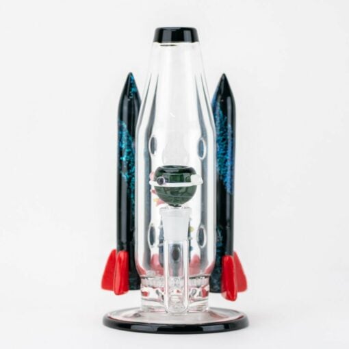 The Empire Glassworks Galactic Flagship Water Pipe is a rocket ship-inspired glass pipe with black and red fins and a clear body, shown on a white background.