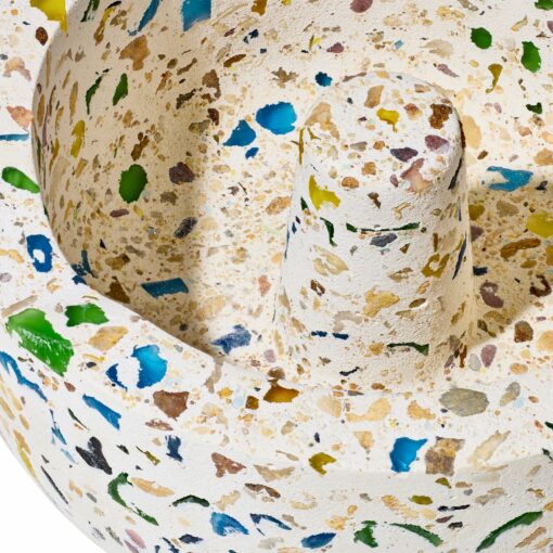 Close-up of the NWTN Home Symi Ashtray, featuring a terrazzo-style, rough off-white surface with colorful blue, green, and yellow fragments.
