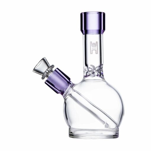 The Human Grade 6" Ball Water Pipe features a clear round base, straight neck, and purple glass accents on the mouthpiece and bowl. Photographed empty on a white background, it promises safe, reliable enjoyment with Human Grade quality.