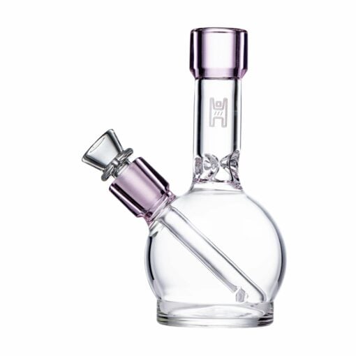 The Human Grade 6" Ball Water Pipe has a round base, light purple accents on the mouthpiece and bowl, an angled downstem for style, and is made from transparent, human grade glass for a clean experience.