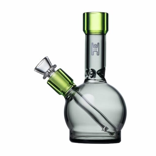 The Human Grade 6" Ball Water Pipe features a clear glass ball design with green-accented mouthpiece and bowl, a round base, and a slanted downstem. Crafted with human-grade materials and shown on a white background.