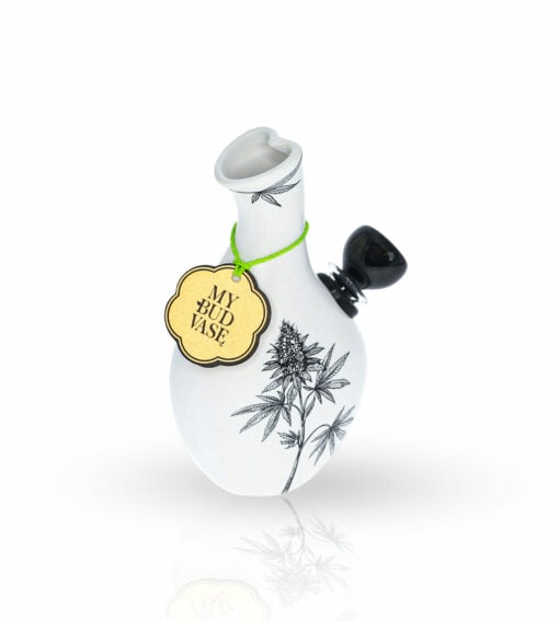 The Love Bud Vase Bong is a white smoking pipe with black floral designs, a small black bowl, and a yellow MY BUD VASE tag tied with green string around the neck, shown on a white background.