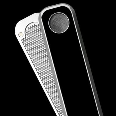A close-up of two metallic High Expectations Genius Pipes—one with a textured surface, the other with a smooth, glossy black finish and round metal mesh—set against a black background.