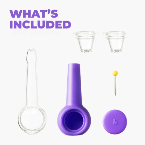The Pipe - Grape kit includes a clear glass pipe, two small glass cups, a grape silicone holder, a yellow-tipped metal pin, and a purple silicone cap—shown on white with “WHAT’S INCLUDED” in bold purple text.