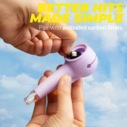 A person inserts The Pipe - Forest against a blue sky, capturing a fresh forest feeling. Above, yellow and white text reads: Better Hits Made Simple. Pair with activated carbon filters.