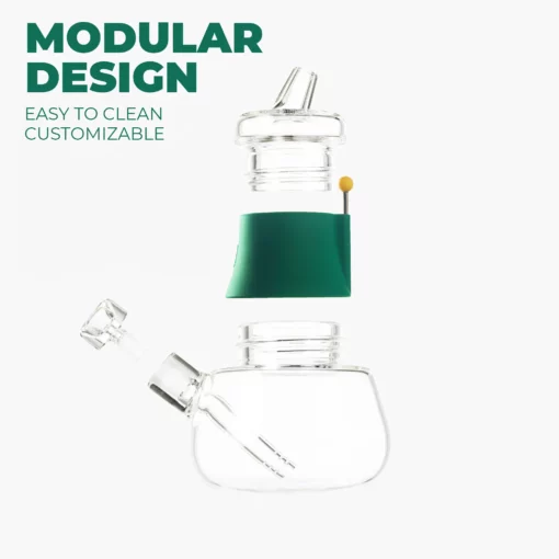 The Bubbler - Forest, a transparent modular glass bubbler with three detachable parts, sits on a white background. Green text in the corner reads "MODULAR DESIGN" and "Easy to clean, customizable," evoking a fresh forest vibe.