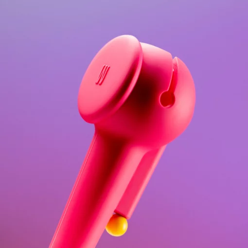 A close-up of The Pipe - Hot Pink, a handheld device with a circular top and yellow button, shown against a purple gradient background. Its design is minimal and modern.