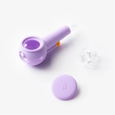 The Pipe - Lavender features a round bowl with a matching lavender lid and a small clear glass piece, all displayed on a white background.