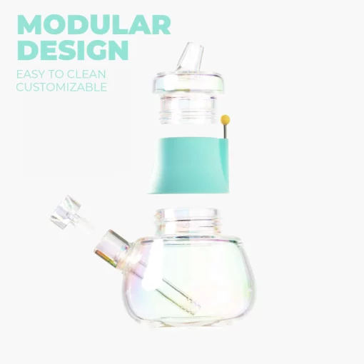 The Bubbler Iridescent - Sky is a transparent, modular glass bubbler with teal accents, shown in three parts. Light blue text highlights its MODULAR DESIGN, easy cleaning, and customization. Its iridescent finish gleams against a white background.