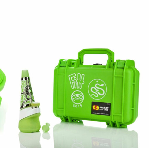 The Ryan Fitt Neon Puffco Peak Complete Set features a bright green hard case with white graffiti-style designs, the Neon Puffco Peak by Ryan Fitt, and two green accessories, all displayed on a white background.