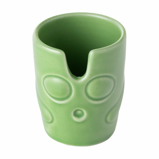 A green ceramic cup from the BigFUN! Potheads Ashtray Set features a notched rim and embossed circular designs resembling an abstract face, set against a white background.