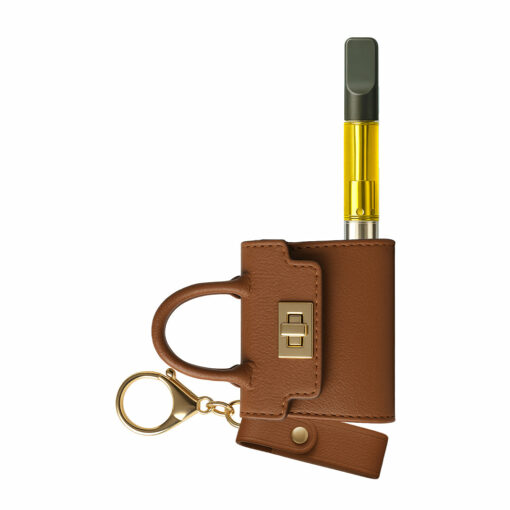 The Penjamin Pursejamin Vaporizer is a brown leather mini handbag keychain with gold hardware, designed to hold a vape pen with a yellow liquid cartridge partially visible.