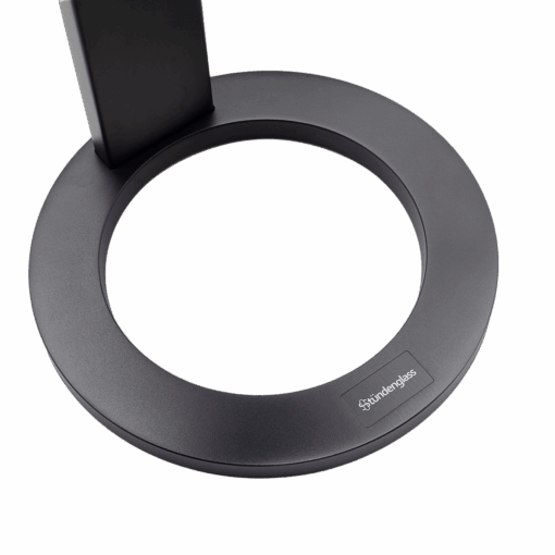 A close-up of the Stündenglass Gravity Infuser’s modern black circular base with a rectangular support and logo label highlights its sleek 360° design against a crisp white background.