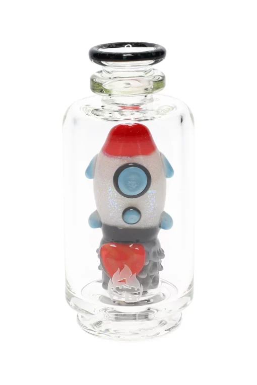 Empire Glassworks Glow Rocket Ship Peak Attachment, a 4½-inch US-made accessory designed to enhance your Puffco setup. This compact, glow-in-the-dark attachment features a whimsical rocket ship design, showcasing vibrant colors and intricate detailing that adds a playful yet functional aesthetic to your cannabis collection. Perfect for those who appreciate unique and artistic smoking accessories, available exclusively at Cannabox.