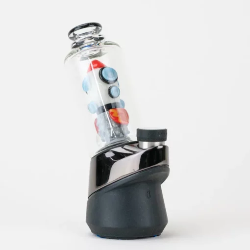 Empire Glassworks Glow Rocket Ship Peak Attachment, a 4½-inch US-made accessory designed to enhance your Puffco setup. This compact, glow-in-the-dark attachment features a whimsical rocket ship design, showcasing vibrant colors and intricate detailing that adds a playful yet functional aesthetic to your cannabis collection. Perfect for those who appreciate unique and artistic smoking accessories, available exclusively at Cannabox.