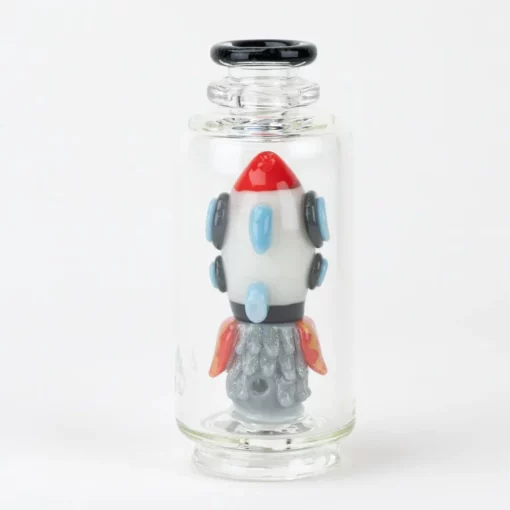 Empire Glassworks Glow Rocket Ship Peak Attachment, a 4½-inch US-made accessory designed to enhance your Puffco setup. This compact, glow-in-the-dark attachment features a whimsical rocket ship design, showcasing vibrant colors and intricate detailing that adds a playful yet functional aesthetic to your cannabis collection. Perfect for those who appreciate unique and artistic smoking accessories, available exclusively at Cannabox.