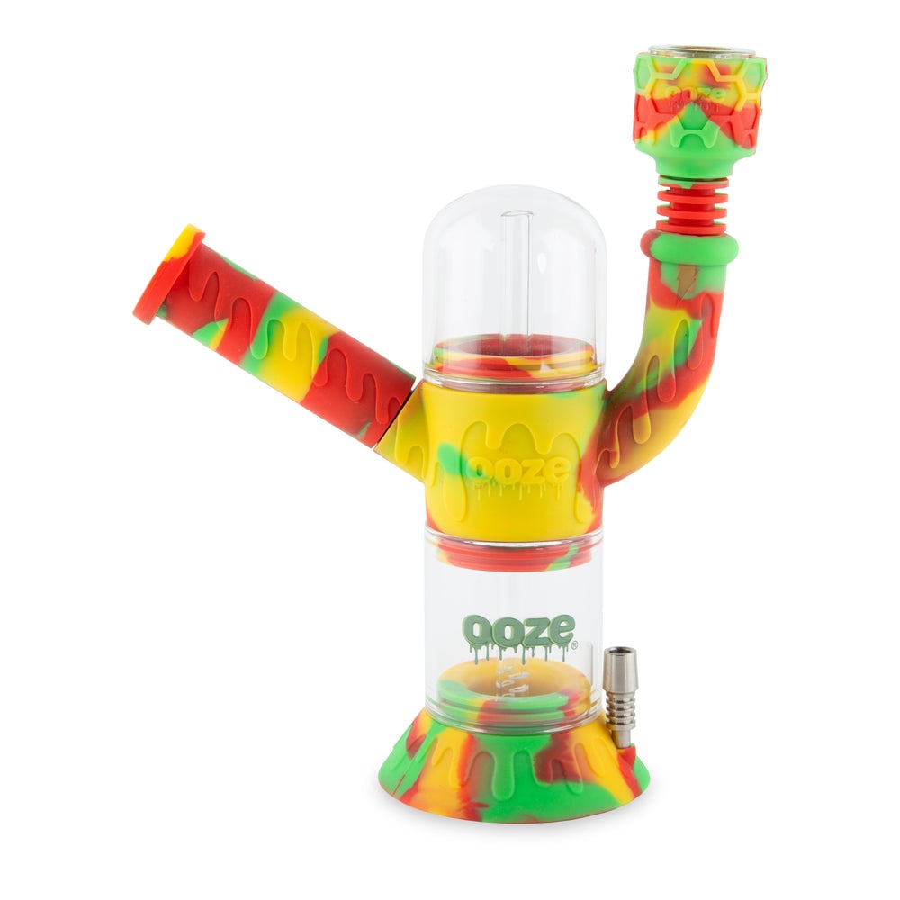 Ooze Cranium 4-in-1 Hybrid Silicone & Glass Water Pipe featuring a striking skull design, showcasing its multifunctional capabilities for enjoying flower and concentrates, perfect for cannabis enthusiasts seeking both style and versatility, available at Cannabox. - Ultra Purple
