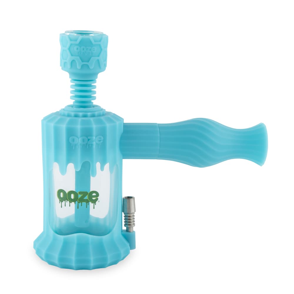 Ooze Clobb 4-in-1 Hybrid Silicone & Glass Water Pipe, featuring a sleek and modern design that combines functionality with aesthetics. This versatile piece allows for seamless transitions between flower, concentrates, and dab straw use, showcasing a unique blend of durable silicone and elegant glass. Perfect for upscale cannabis culture enthusiasts, available at Cannabox. - Ultra Purple