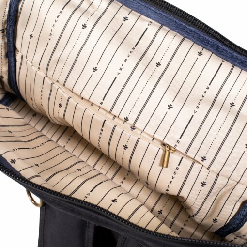 The Drifter rolltop backpack featuring a sleek design, smell-proof technology, and water-resistant materials, ideal for everyday smokers on the go.