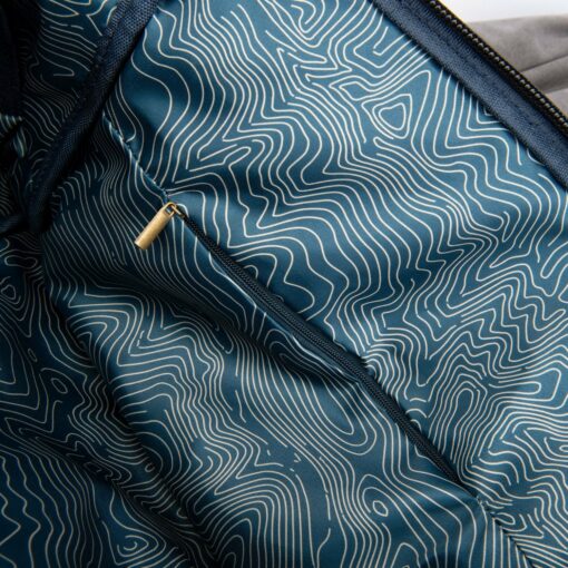 The Drifter rolltop backpack featuring a sleek design, smell-proof technology, and water-resistant materials, ideal for everyday smokers on the go.