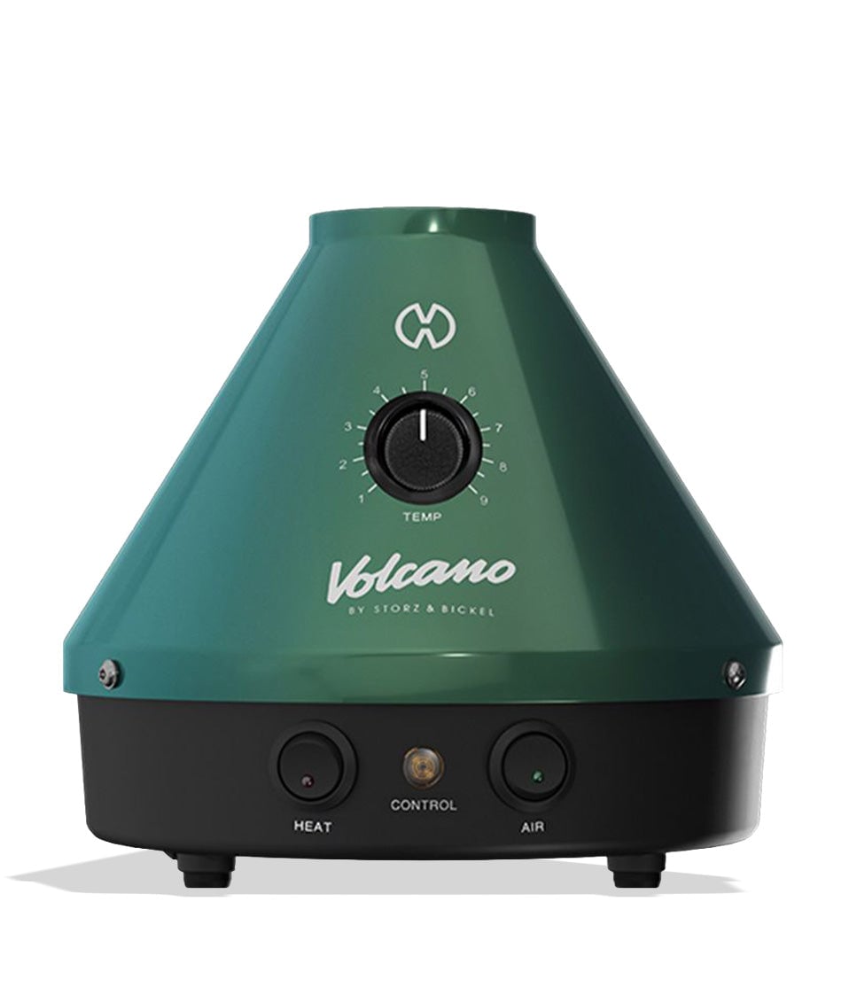 The Storz & Bickel Classic Volcano Vaporizer Evergreen Edition, featuring a sleek and modern design with a vibrant green finish, is showcased against a stylish backdrop. This premium vaporizer is designed for both dry herbs and concentrates, highlighting its versatility and functional aesthetics, perfect for everyday smokers seeking an elevated vaping experience from Cannabox. - Default Title
