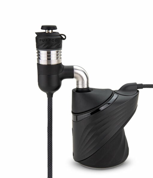 Puffco Peak Pro Link attached to 10mm glassware, showcasing its sleek design and enhanced filtration capabilities for dabbing.