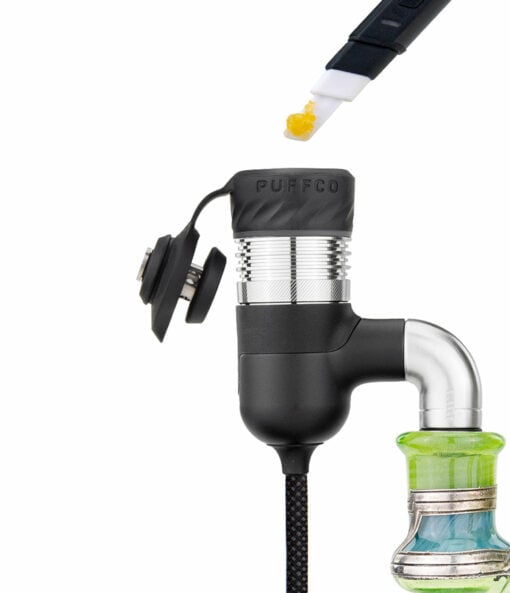 Puffco Peak Pro Link attached to 10mm glassware, showcasing its sleek design and enhanced filtration capabilities for dabbing.